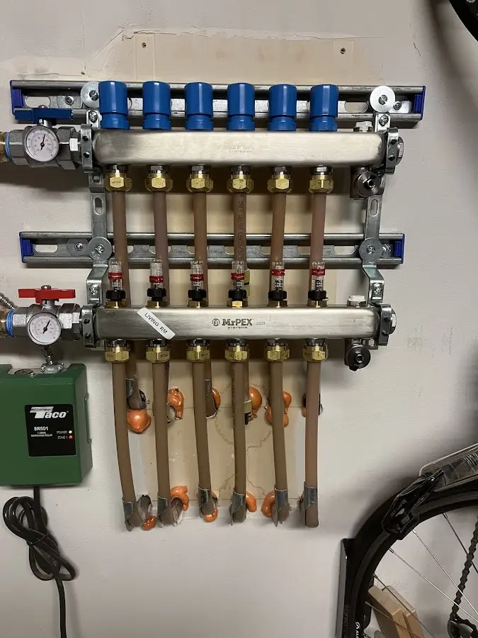 Plumber performing Water Heater Repair at a residential property in Country Club